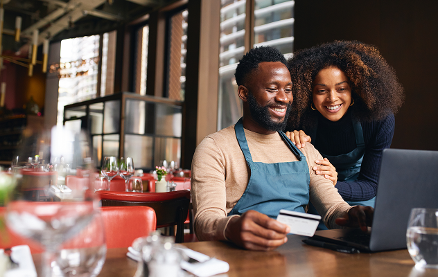 Man and woman with their business debit mastercard